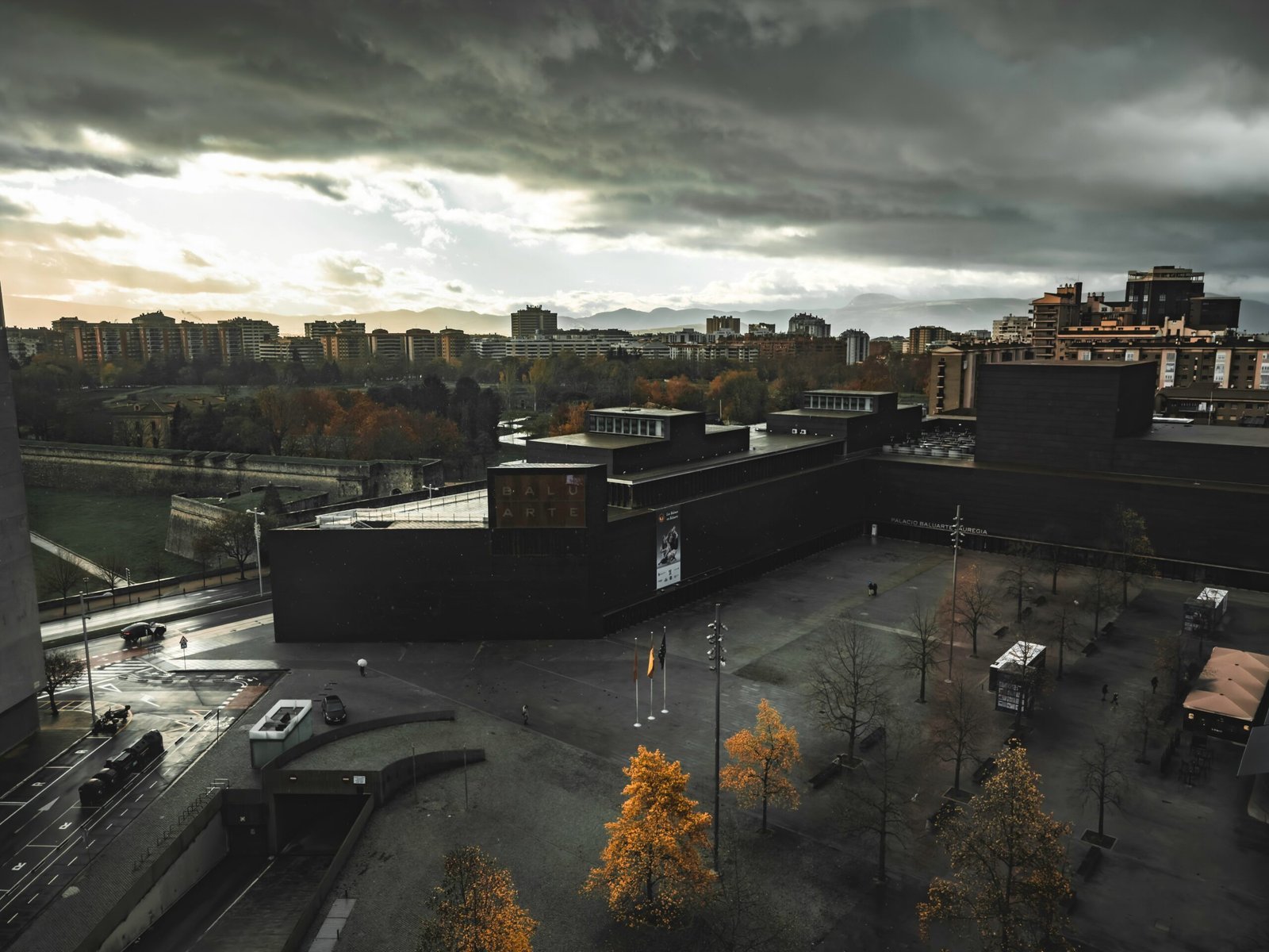 a cloudy sky over a city with buildings